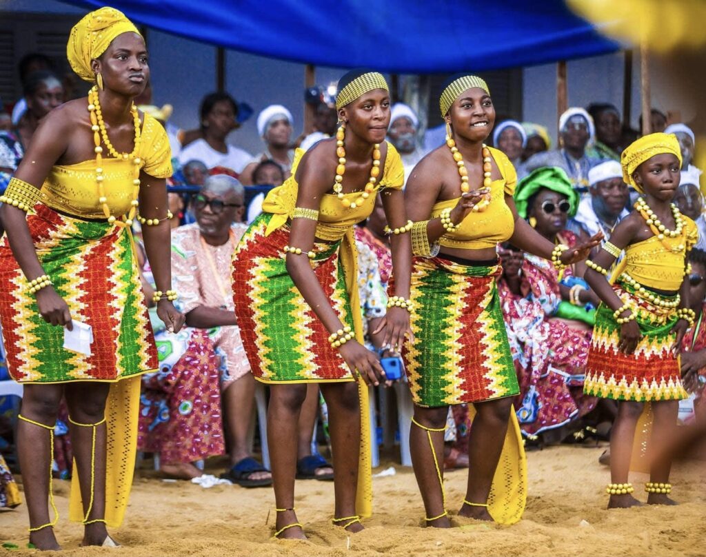 N'zima dancers in pagne cloth and bead necklaces during the Abissa festival in Grand-Bassam