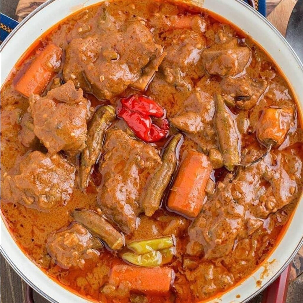 Meat stew with peanut sauce, carrots and okra
