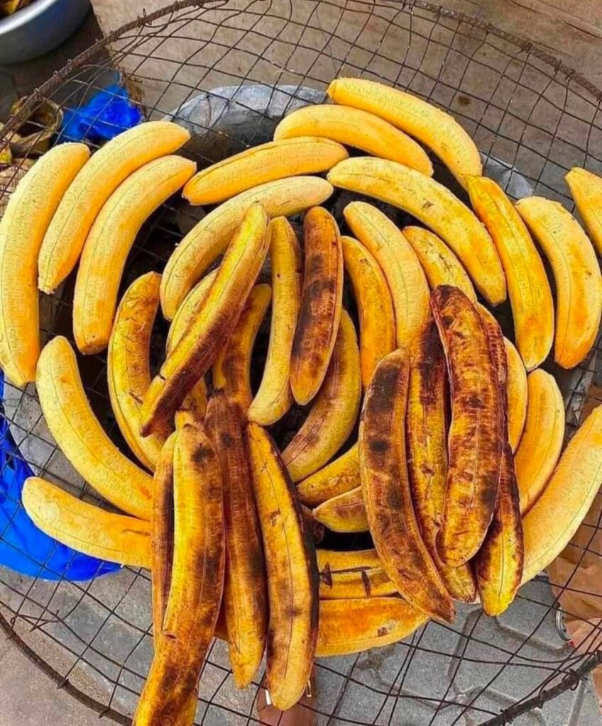 Plantains roasted over charcoal at a street stall in Abidjan